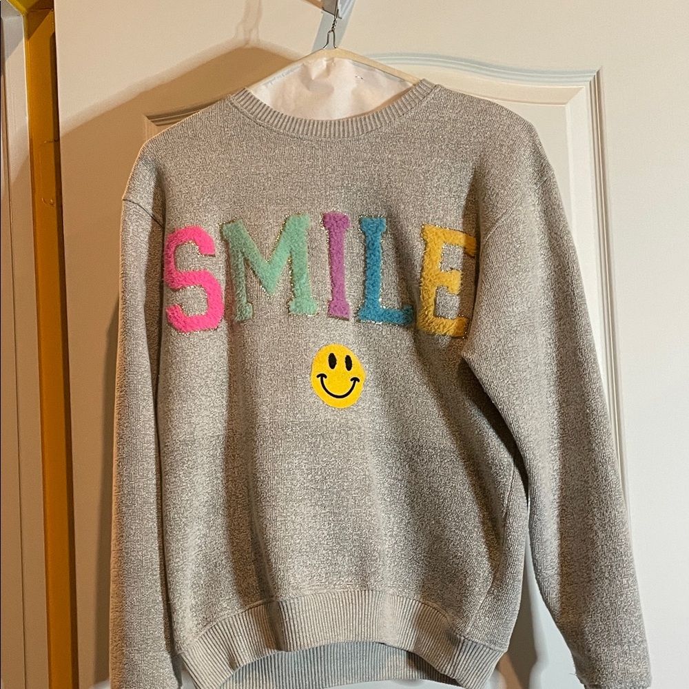 Gray Sweatshirt with Colorful 'SMILE' Design